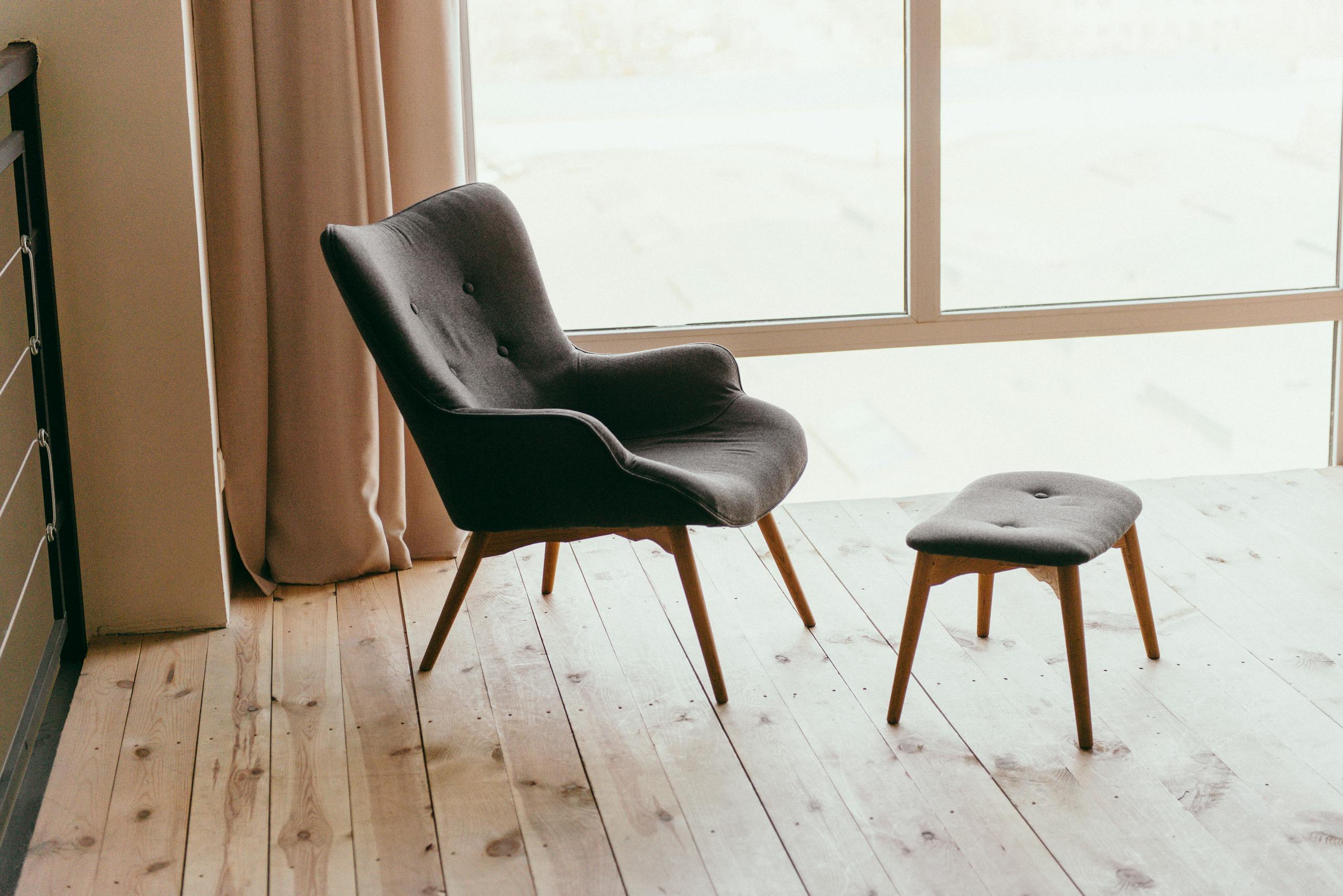 Contemporary armchair in a minimalist room with sunlight streaming through windows