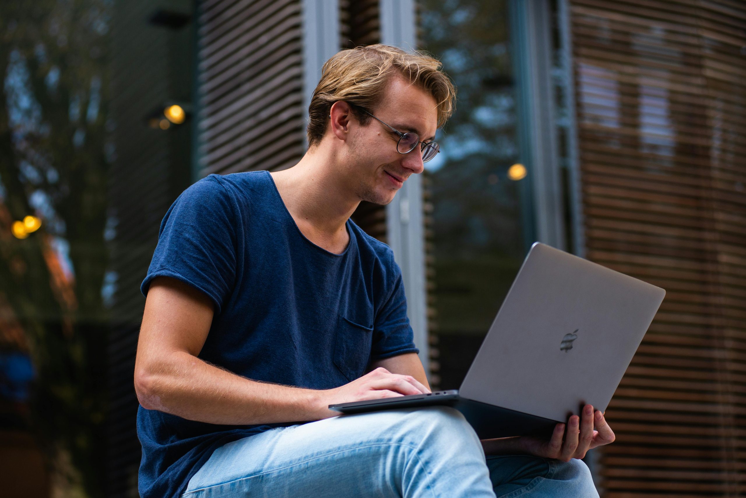 Person working on laptop representing sleep tracking technology and data analysis