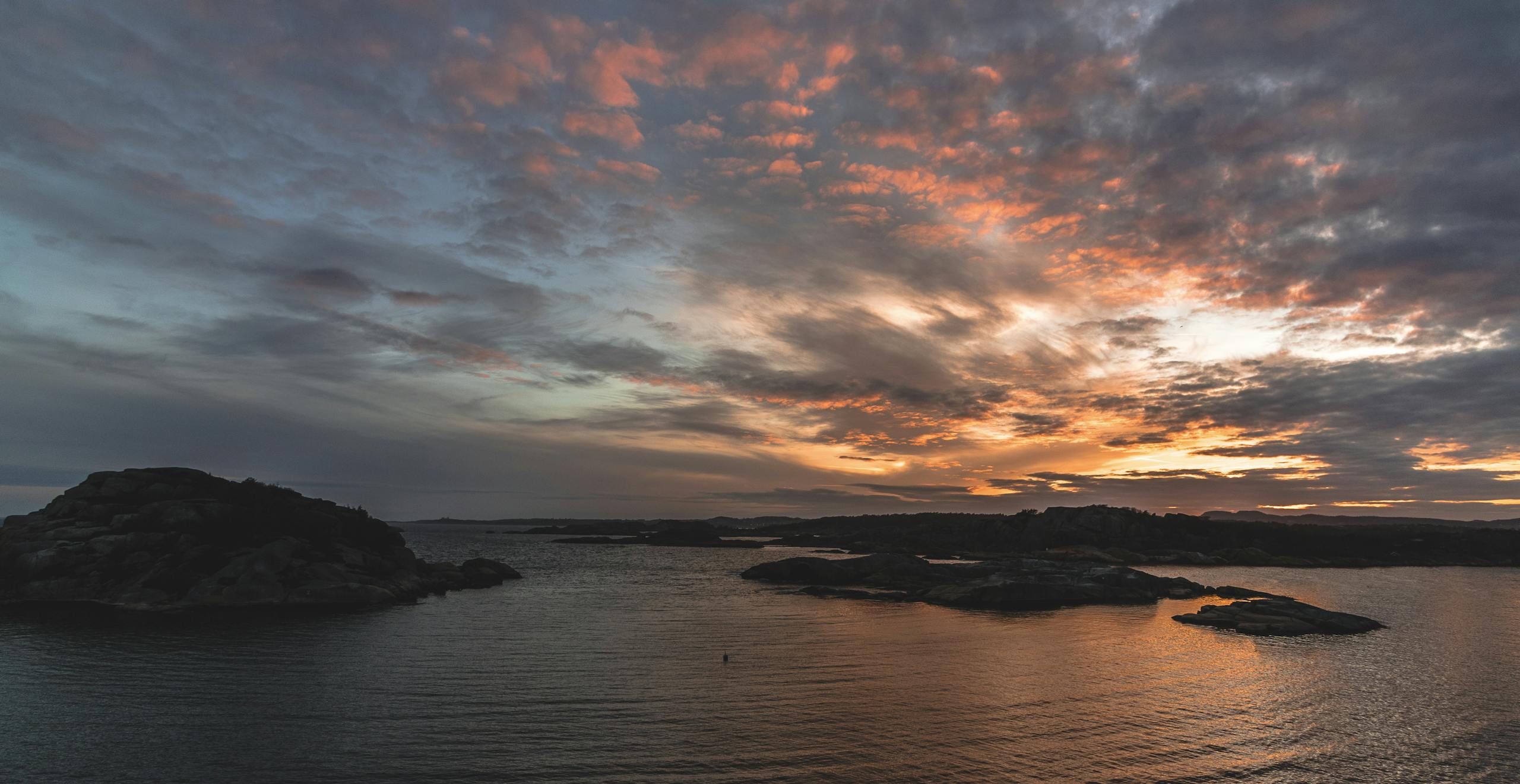 Calm ocean view at sunset suggesting rest and recovery from a good night's sleep