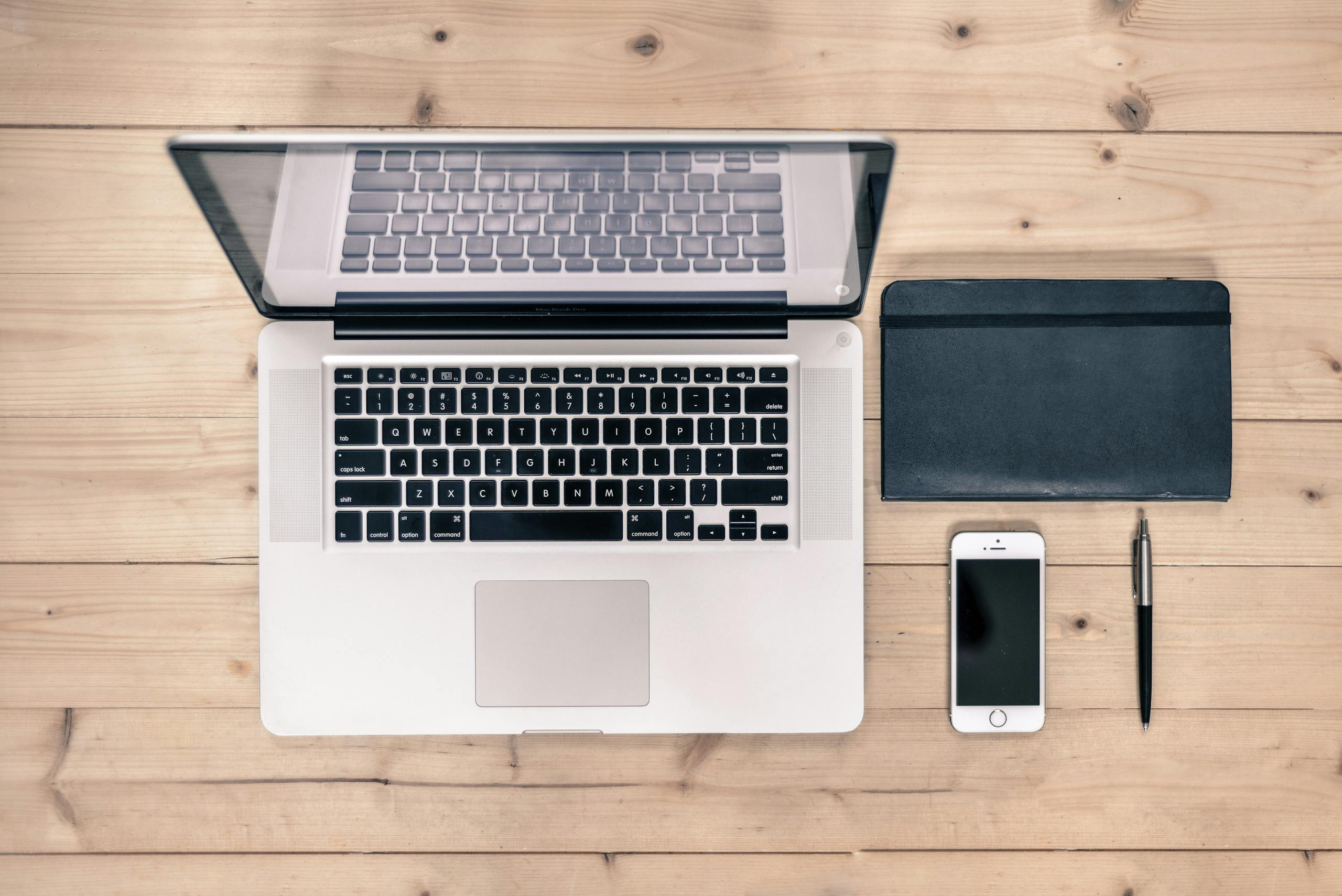 Clean workspace setup with smartphone and laptop for smart home sleep device management