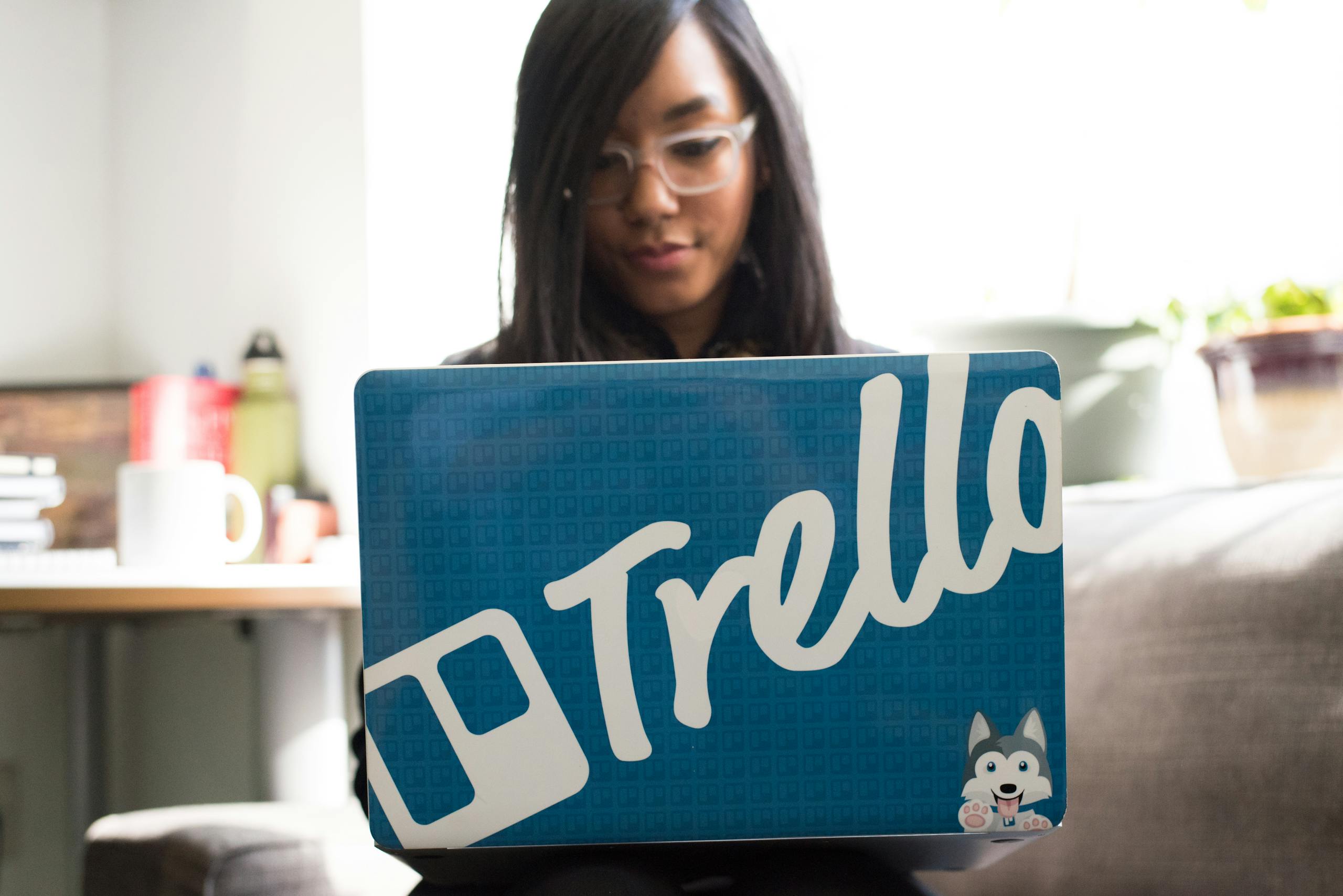 Person reviewing health tracking data on laptop showing sleep metrics and wellness scores