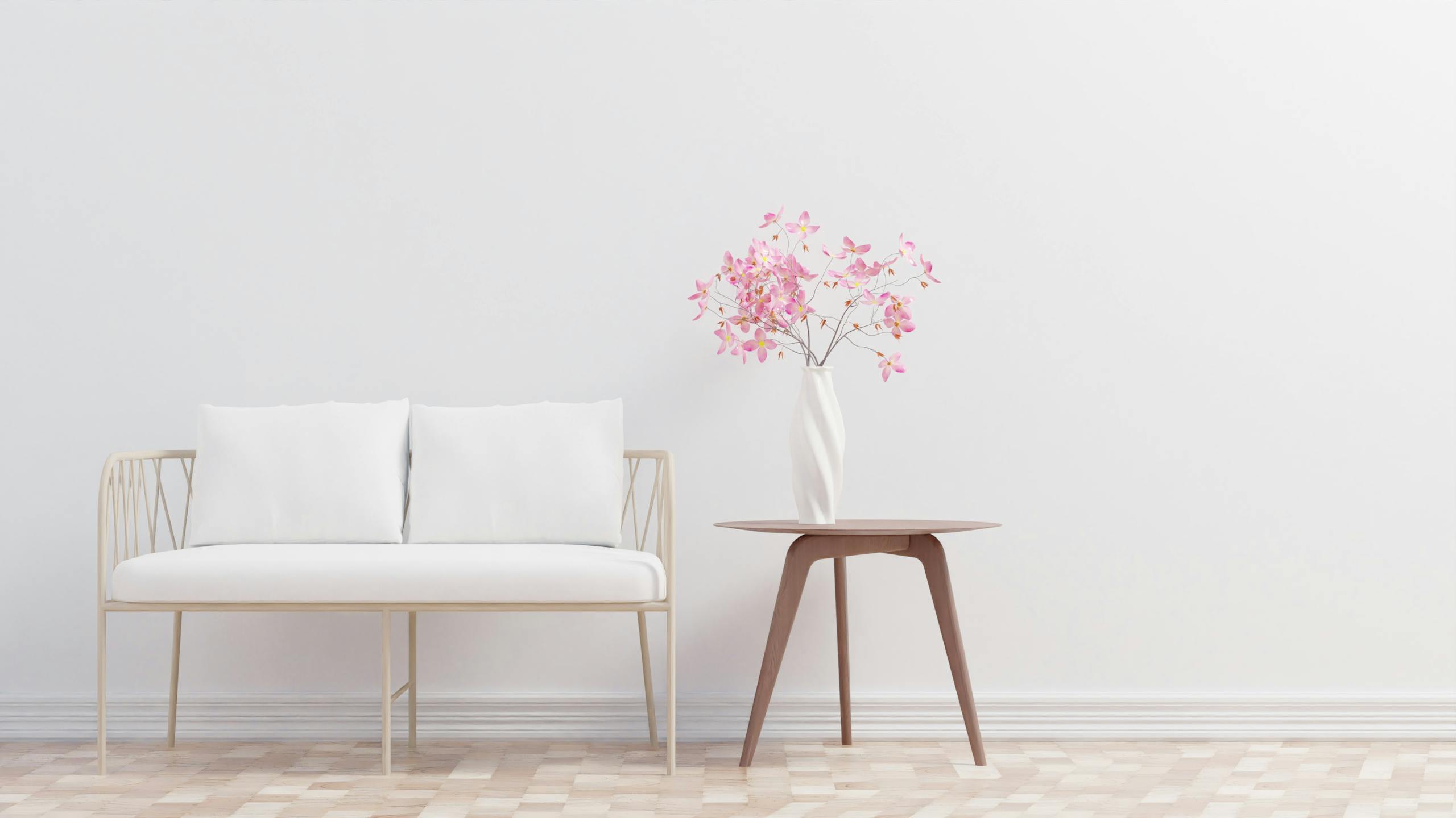Clean minimalist bedroom space with comfortable furnishings and calming neutral color scheme
