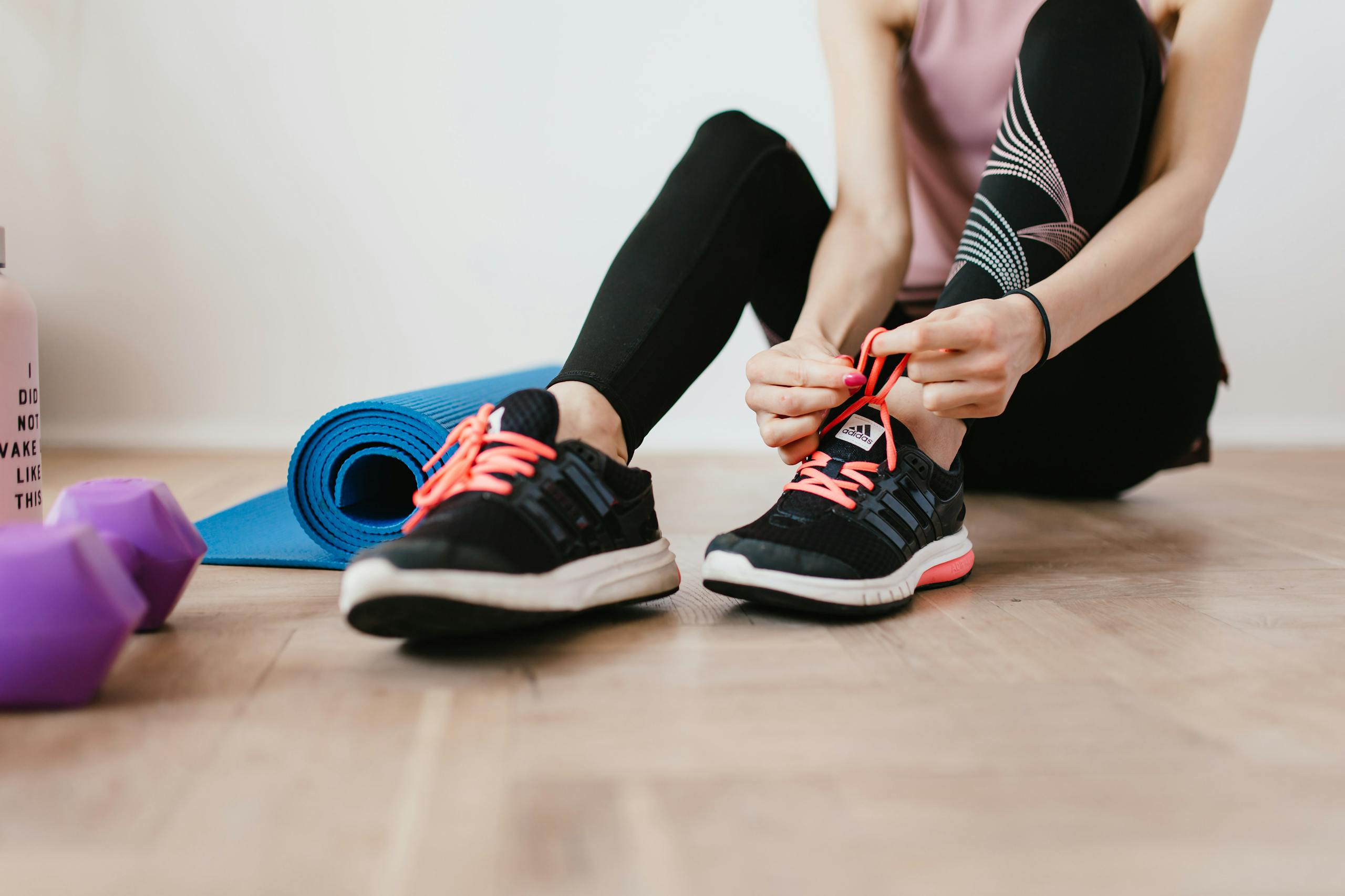 Athlete preparing for workout session with fitness equipment for training and recovery tracking