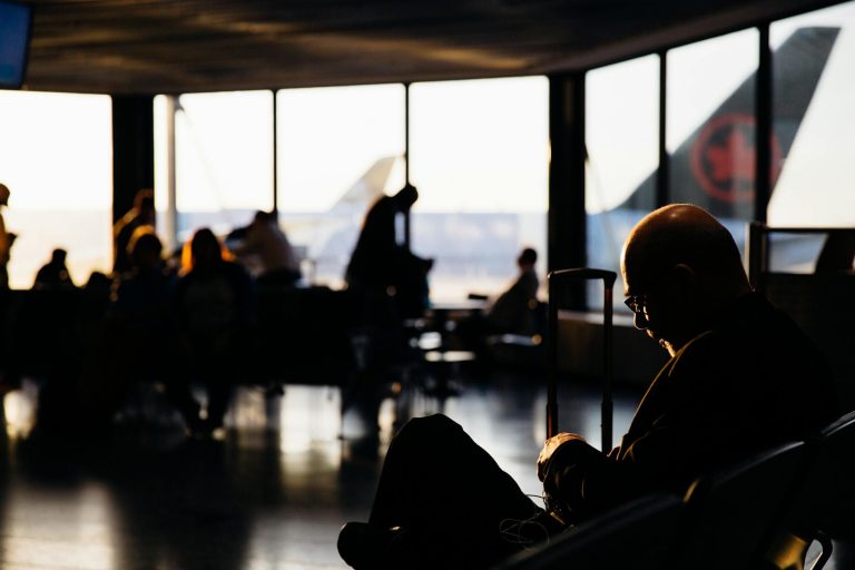 Traveler experiencing jet lag symptoms at international airport
